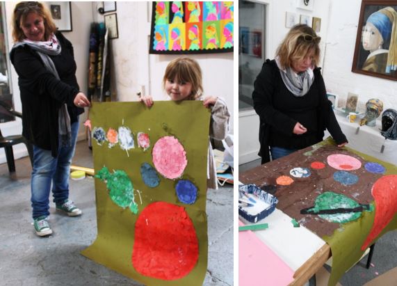 Petra Lea with Millie Johnson (4, Middlewich), working on paper mosaic